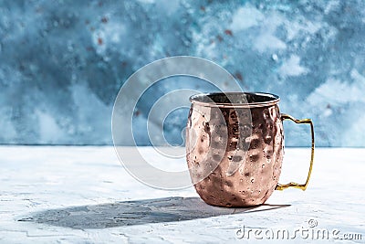 Hammered Vintage Copper Mug. Shiny copper Moscow Mule mug with handle Stock Photo
