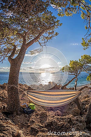 Hammock net installed on Punta Rata beach in Brela, Croatia, Dalmatia, Croatian azure coast Stock Photo