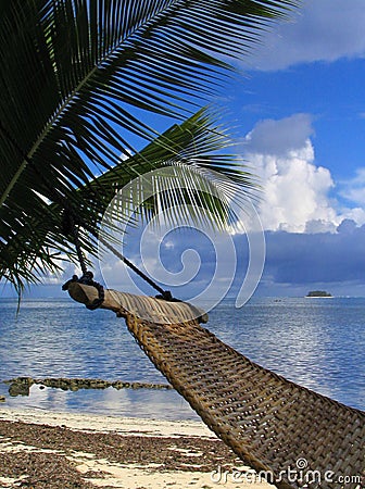 Hammock on tropical beach Stock Photo