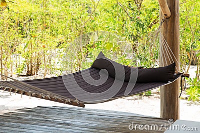 Hammock on tropical beach terrace Stock Photo
