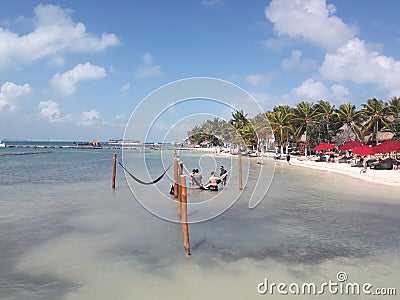 Hammocks over ocean in Isla Mujeres Cancun Mexico beach travel tourism ocean blue water sky sunny Editorial Stock Photo