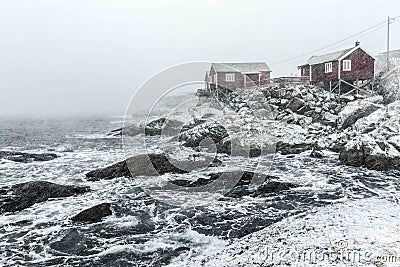 Hamnoy, Norway, fishing village on Lofoten Islands during a snow storm Stock Photo
