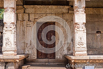 Dark brown wooden door at Nandi Monolith temple, Hampi, Karnataka, India Editorial Stock Photo