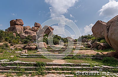 Stairway to hill summit at Nandi Monolith temple, Hampi, Karnataka, India Stock Photo