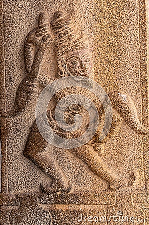 Stone mural sculpture of dancing woman at Kadelekalu Ganesha temple, Hampi, Karnataka, India Stock Photo