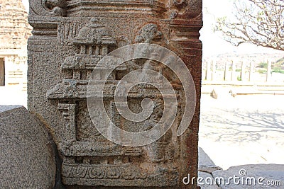 Hampi Vittala Temple pillar carving of hanuman monkey god landing on the palace of Ravana the demon king Stock Photo