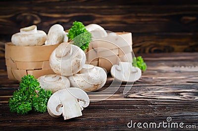 Ð¡hampignons with parsley in a basket Stock Photo