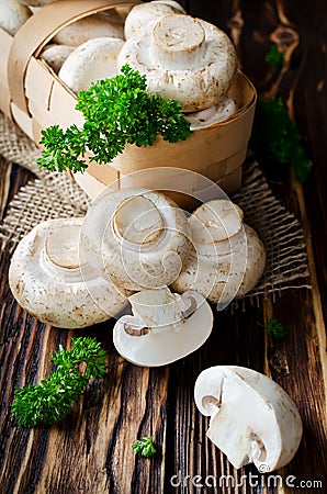 Ð¡hampignons with parsley in a basket Stock Photo