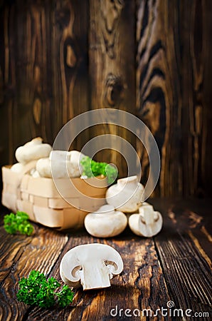 Ð¡hampignons with parsley in a basket Stock Photo