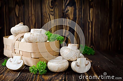 Ð¡hampignons with parsley in a basket Stock Photo