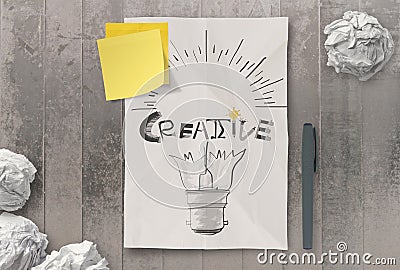Han drawn light bulb and CREATIVE word design on clumpled paper Stock Photo
