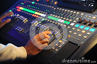 Hand adjusting sound mixer Stock Photo