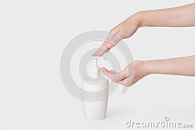 Hand antibacterial sanitizer dispenser pump, alcohol gel to wash hands, liquid soap to clean hands free from viruses and diseases. Stock Photo