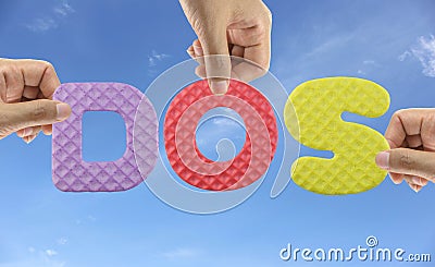 Hand arrange alphabet DOS of acronym Disk Operating System. Stock Photo