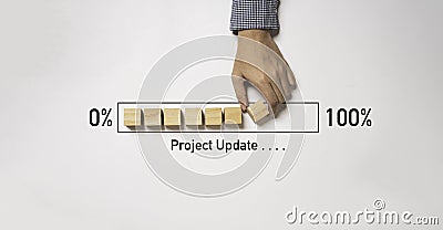 Hand arrange wooden block cube download bar from 0% to 100% for project update progress concept Stock Photo