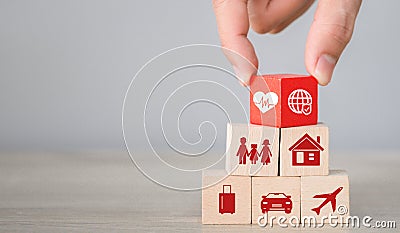 Arranging wood block stacking with icon insurance: car Stock Photo