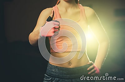 The hand of an athletic, beautiful woman shows a thumb up, like, good, approval. Stock Photo