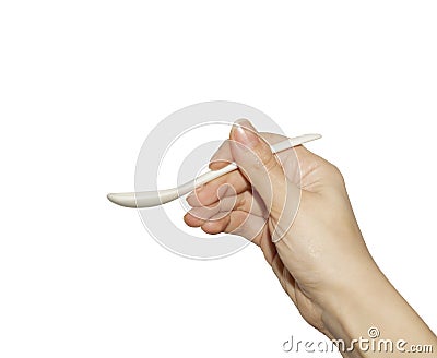 Hand with baby spoon Stock Photo