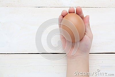 Hand balancing eggs chicks are born Stock Photo