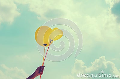 Hand and balloon blue sky Stock Photo