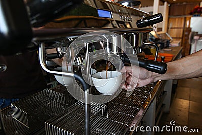 hand barista make coffee from professional machine, selective focus, beverage concept. Stock Photo