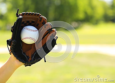 Hand of Baseball Payer with Glove and Ball Stock Photo