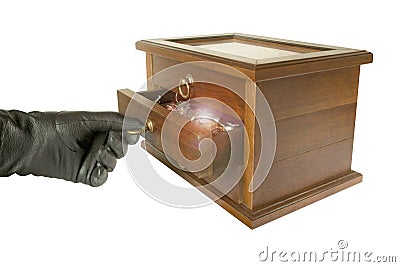 Hand in black glove opening casket with jewelry Stock Photo