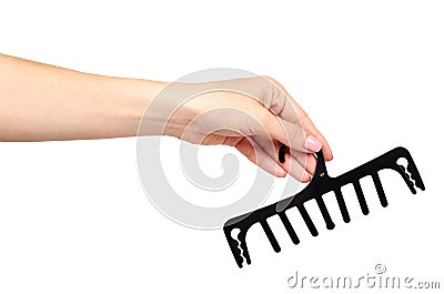 Hand with black plastic clothes hanger. Isolated background Stock Photo