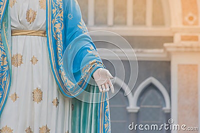 Hand of The Blessed Virgin Mary statue standing in front of The Roman Catholic Diocese. Stock Photo