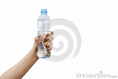 Hand with bottle of corner, girl holding a bottle of water in her hand, small bottle, isolated Stock Photo