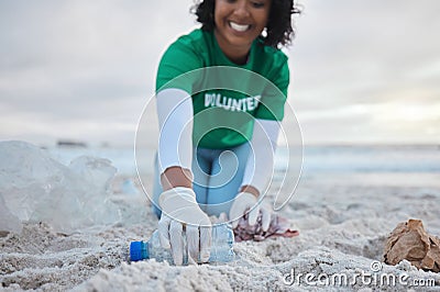 Hand, bottle and a volunteer woman on the beach for community, charity or activism during a clean up. Cleaning Stock Photo