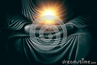 Hand of buddha with light of wisdom and power Stock Photo