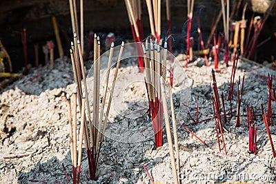 Hand burning incense Stock Photo