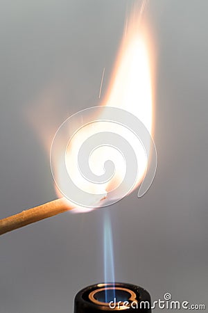 Hand burning match stick. A photo on a gray background. International Day matchstick. Stock Photo