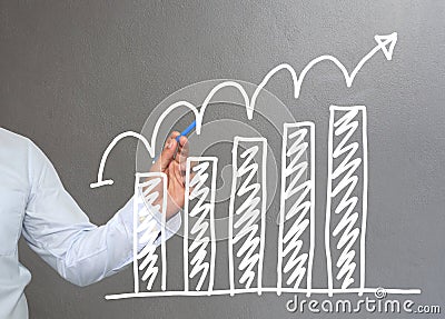 Hand of businessman drawing graphics a top point growing graph t Stock Photo