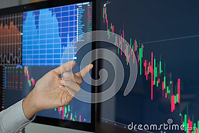 Hand of businessman group pointing and look directions change Average line Share price movement Stock trading in the up and down. Stock Photo