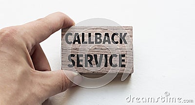 Hand of a businessman holding wooden blocks. Conceptual image. Text callback service concept business succeed Stock Photo