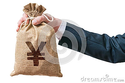 Hand of businessman holds bag full of money with Yen sign. Stock Photo