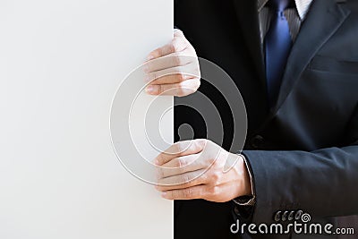 Hand of businessman pull white background Stock Photo