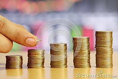 Hand of businessman is stack gold coin of financial grown concept. Stock Photo