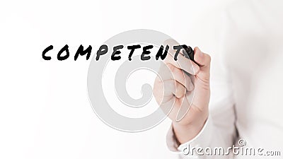 Hand of a businessman writing a word Competent with black marker Stock Photo
