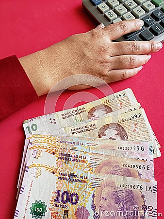 hand of a businesswoman counting argentinean banknotes Stock Photo