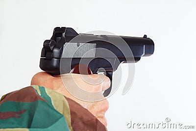 Hand in camouflage uniform with a semi-automatic army gun close up Stock Photo