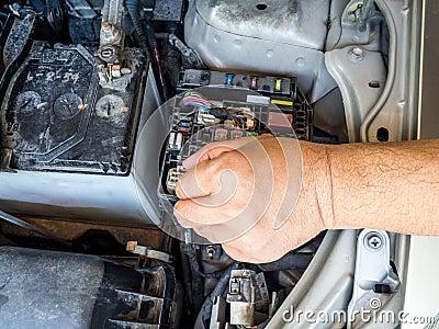 Hand of car mechanic working in auto repair service. Stock Photo