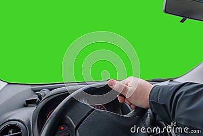 Hand on a car steering wheel. Maneuver on car, make a sharp left turn. Green screen. copy space Stock Photo