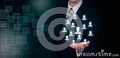 Hand carrying businessman icon network - HR teamwork and leadership concept. Stock Photo