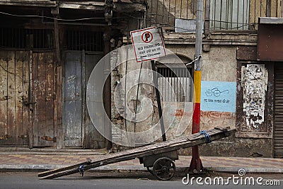 Hand cart parked near an old run down building Pune, Maharashtra, India Editorial Stock Photo