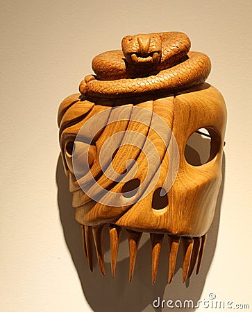 Hand carved rattlesnake mask in Cherokee Indian Museum Editorial Stock Photo