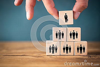 Organization and team structure symbolized with cubes Stock Photo