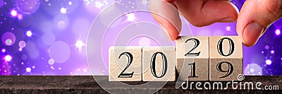 Hand Changing Date From 2019 To 2020 Stock Photo